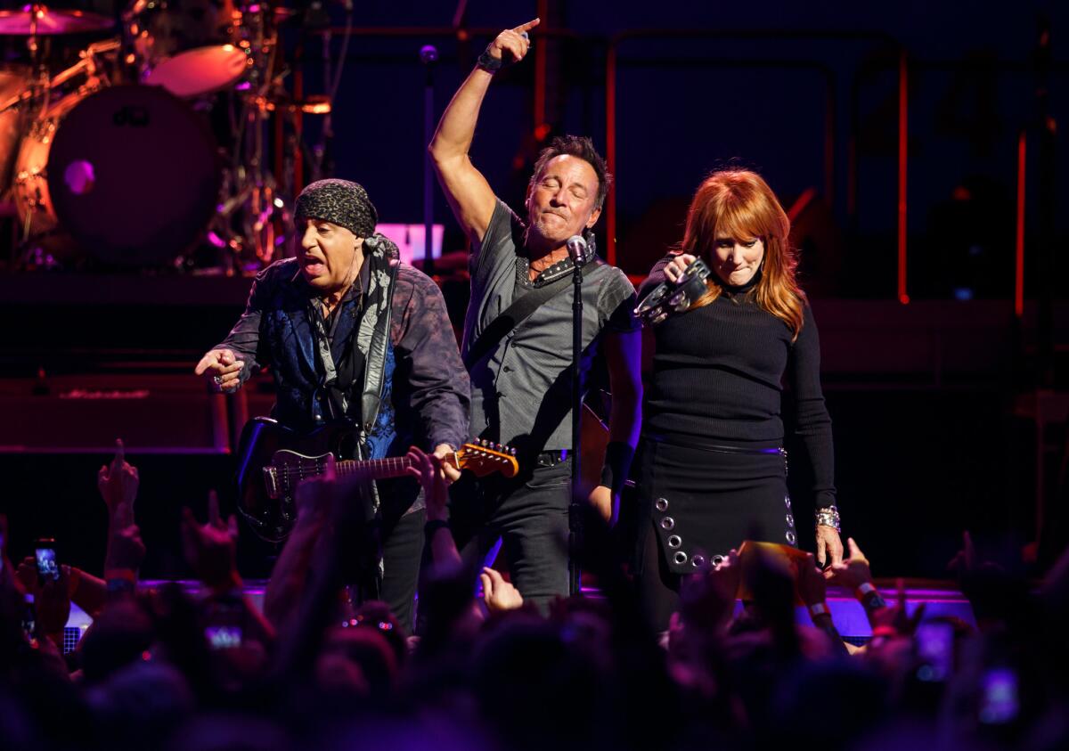 Bruce Springsteen is flanked by Steve Van Zandt, left, and Patti Scialfa during the E Street Band's performance in March at the Los Angeles Sports Arena. Springsteen logged the top-grossing concert tour of 2016 worldwide, according to Pollstar.