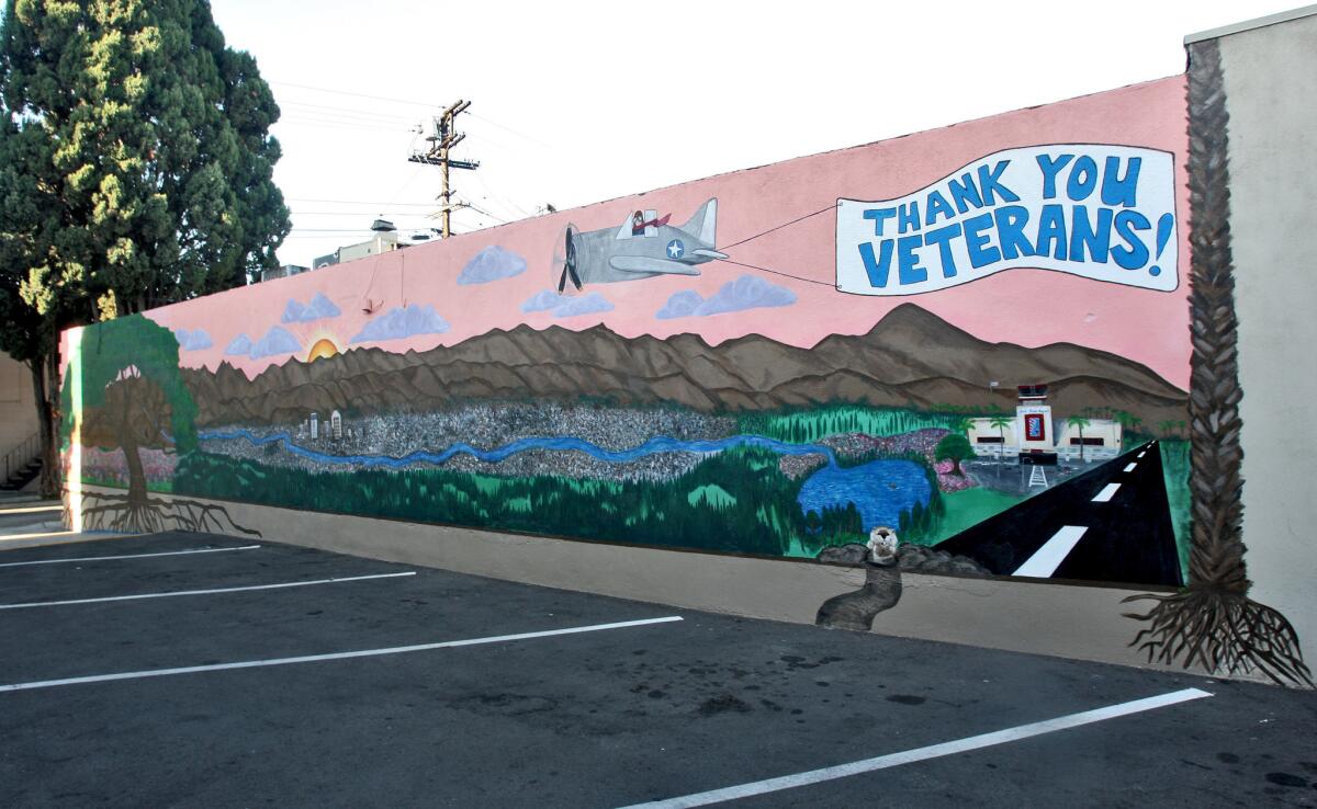Mural by artist Chelsea Hover on a wall adjacent to the Cypress Senior Living complex on the 300 block of E. Cypress Ave. in Glendale on Friday, October 2, 2015. The mural is a little over a year old.
