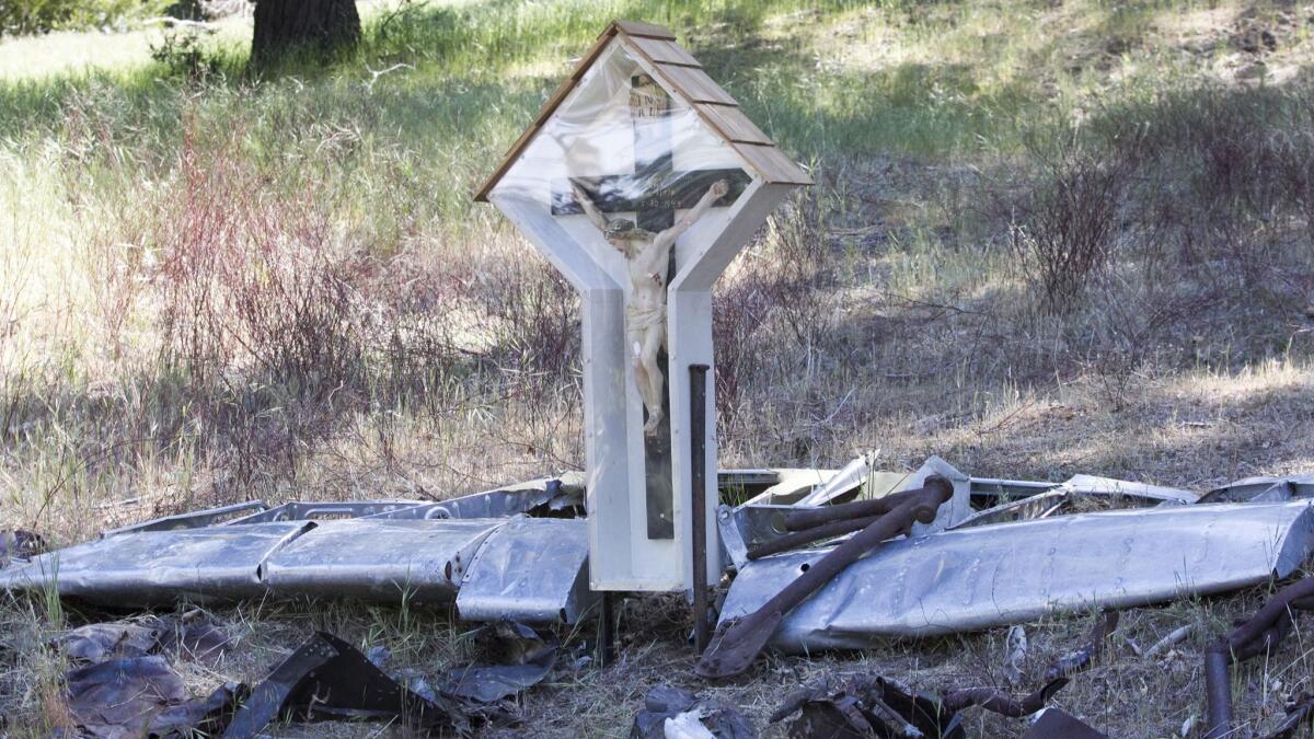 A crucifix that had belonged to one of the doomed airmen is part of the memorial on Palomar Mountain.