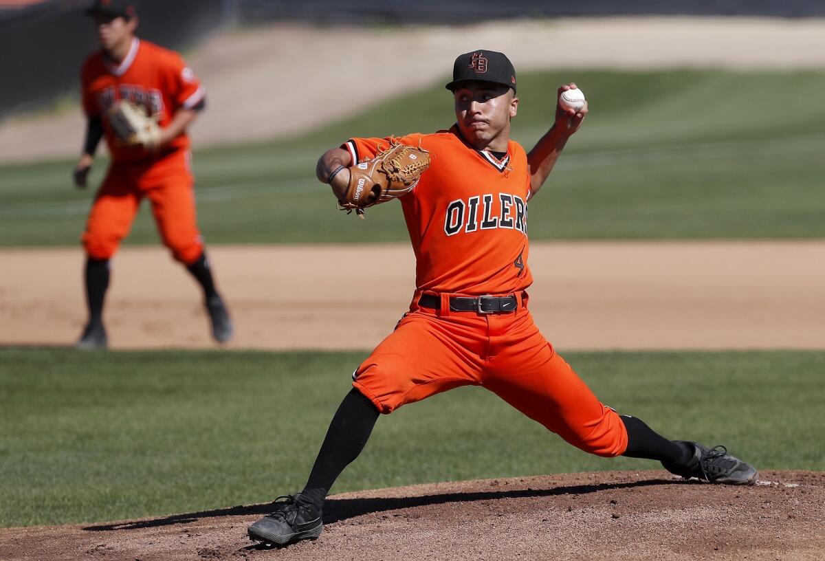 Huntington Beach High's Edward Pelc, picturing throwing against Fountain Valley on March 15, threw five shutout innings in the Oilers' 1-0 win over Moorpark in a CIF Southern Section Division 1 first-round game Thursday.