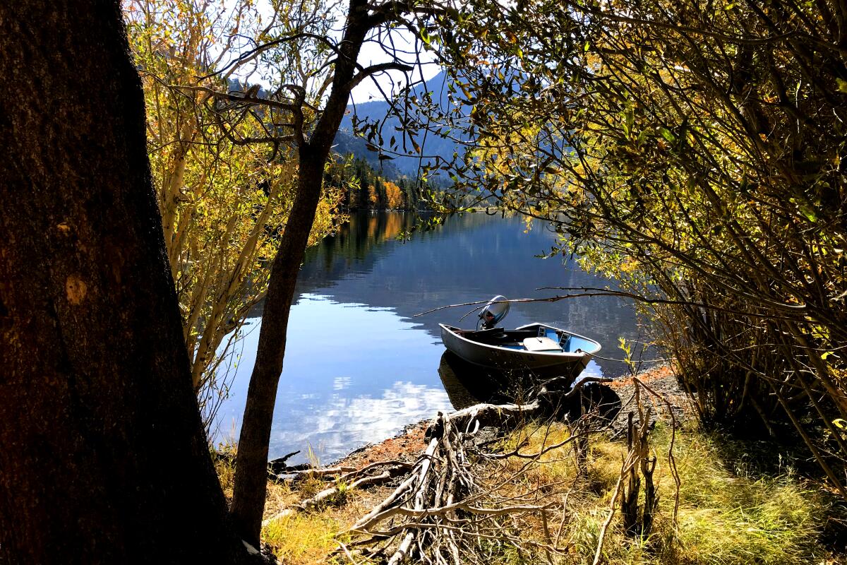 An idle row boats floats in Silver Lake near Mammoth Lakes.