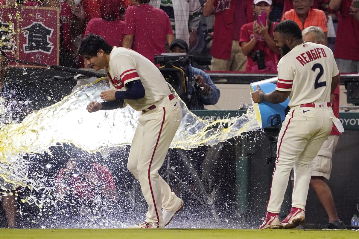 Angels' Luis Rengifo tosses liquid at starting pitcher Shohei Ohtani after a game.