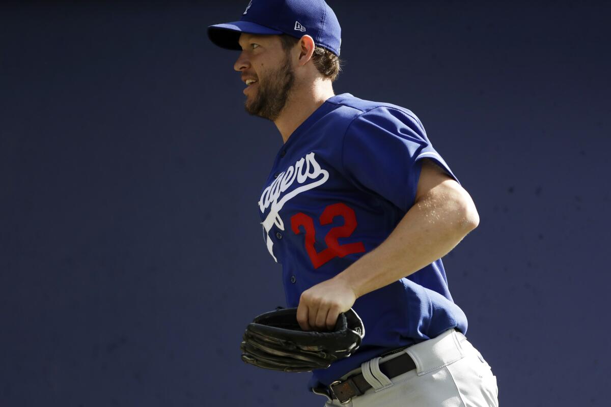 Dodgers pitcher Clayton Kershaw runs during spring training practice on Feb. 21.