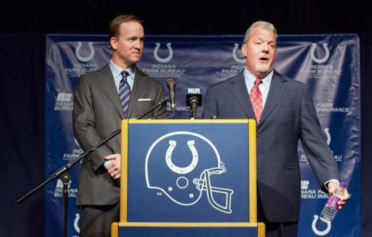 Peyton Manning, left, and Jim Irsay.