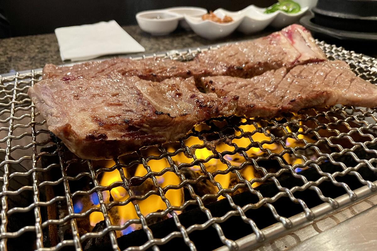 An order of galbi on the grill at Soowon Galbi in Koreatown.
