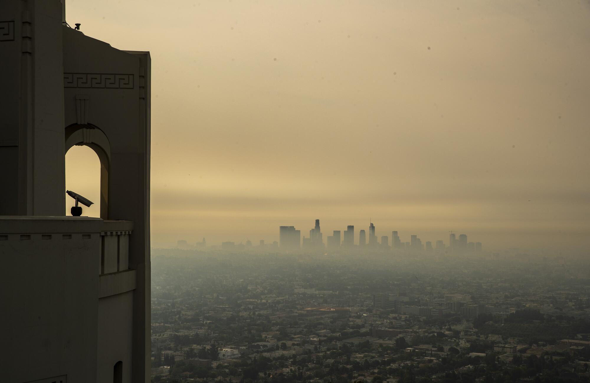 Smoke nearly obscures the Los Angeles skyline.