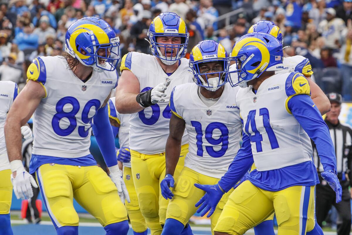 Rams running back Malcolm Brown celebrates with teammates after scoring a touchdown against the Chargers.