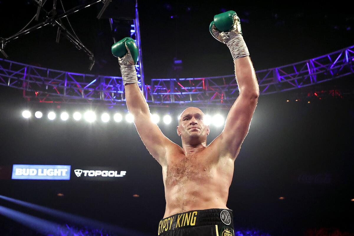 Tyson Fury celebrates after knocking down Deontay Wilder during their WBC heavyweight title fight on Feb. 22, 2020, in Las Vegas.