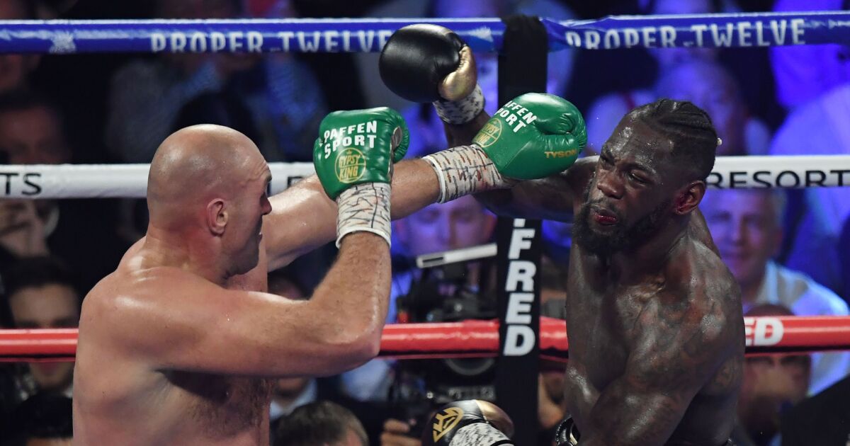 Deontay Wilder Tyson Fury Rematch Set To Take Place In July Los Angeles Times