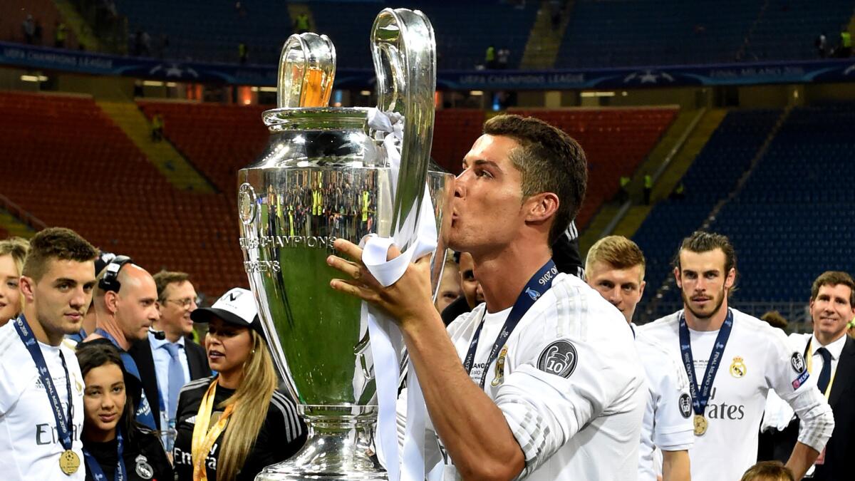 Cristiano Ronaldo kisses the trophy after Real Madrid won the UEFA Champions League final on Saturday.
