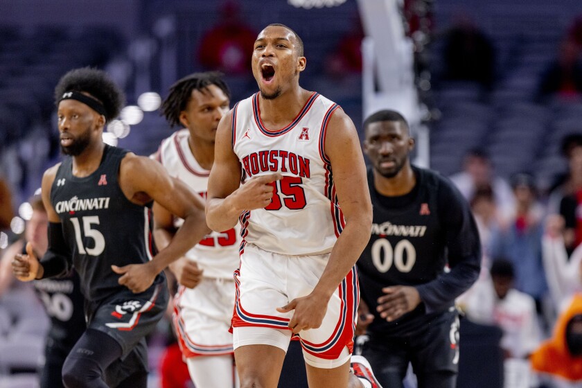 Houston forward Fabian White Jr. (35) celebrates after a making a basket during the second half of an NCAA college basketball game against Cincinnati in the quarterfinals of the American Athletic Conference tournament in Fort Worth, Texas, Friday, March 11, 2022. (AP Photo/Gareth Patterson)