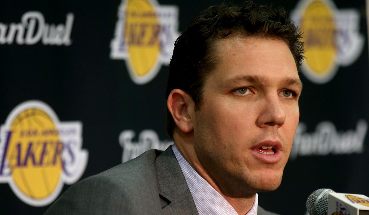 New Lakers Coach Luke Walton answers reporters' questions during a press conference on Tuesday at the team's training facility in El Segundo.