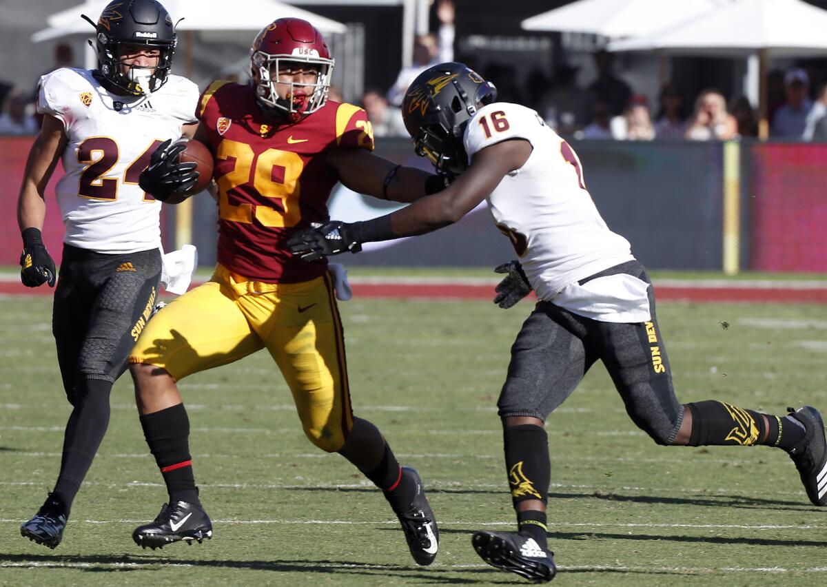 USC tailback Vavae Malepeai breaks loose for a long gain against Arizona State in the fourth quarter on Saturday at the Coliseum.
