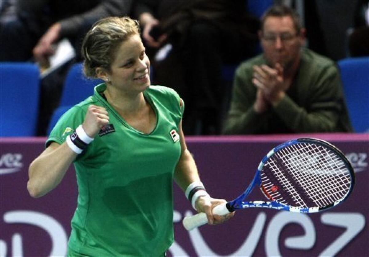 Belgium's Kim Clijsters celebrates her win against Australia's Jelena Dokic during the Paris Open tennis tournament at Coubertin stadium in Paris, Friday, Feb. 11, 2011. Clijsters of Belgium secured the No. 1 ranking by defeating Jelena Dokic of Australia 6-3, 6-0 on Friday to reach the semifinals of the Open Gaz de France.. (AP Photo/Jacques Brinon)