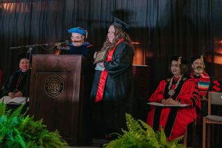 Andrea Van Bebber receives her diploma.