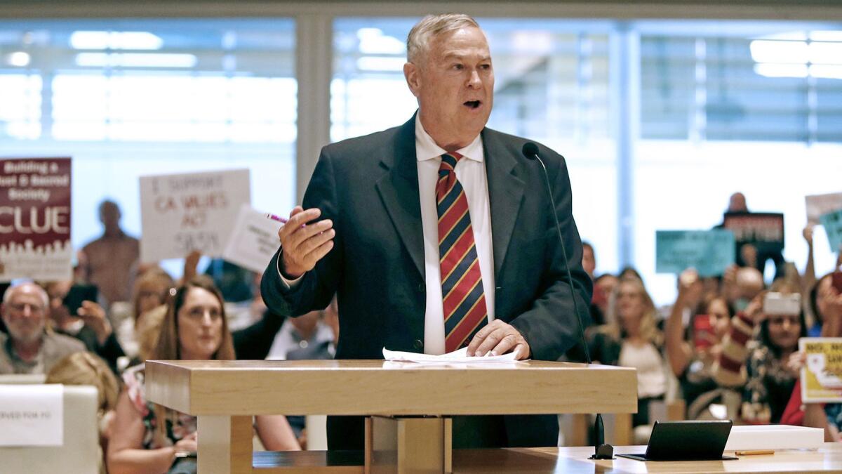 Rep. Dana Rohrabacher (R-Cosa Mesa) speaks in support of the Newport Beach City Council's vote to join a lawsuit against California over its sanctuary law during public comments on April 10.