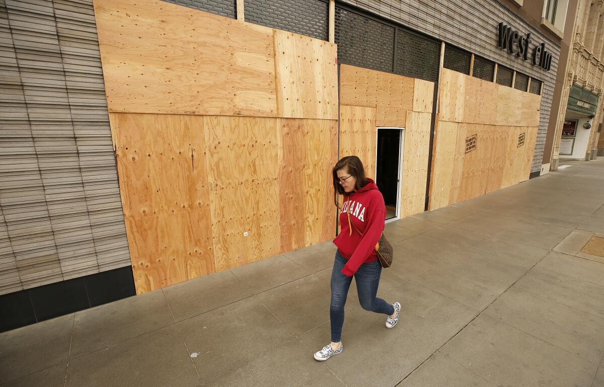 Some retailers in Beverly Hills and Pasadena have boarded up their storefronts during the coronavirus pandemic, possibly to avert vandalism.