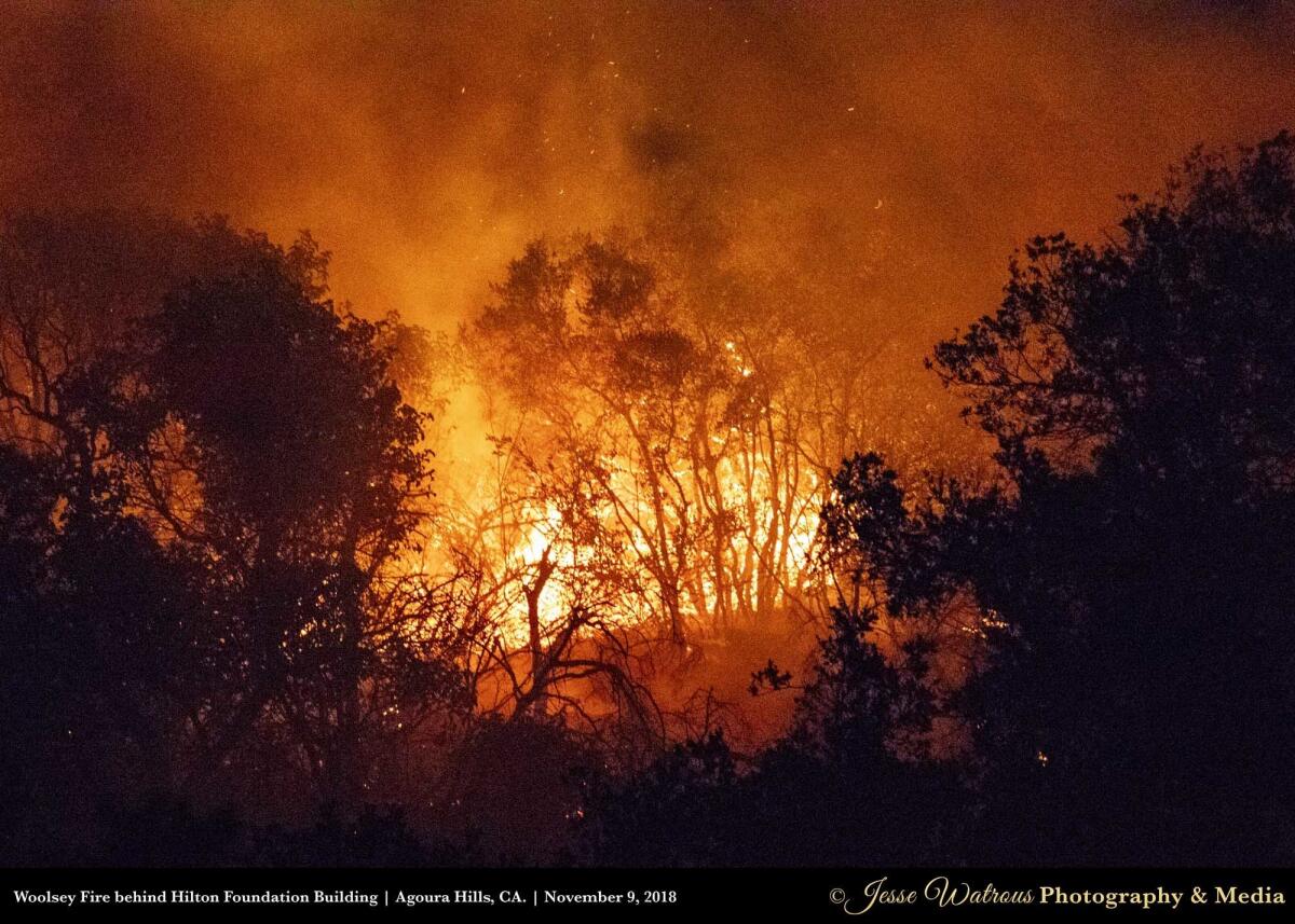 Woolsey Fire burning behind the Hilton Foundation in Agoura Hills, Calif. on Nov. 9, 2018. Â© Jesse Watrous Photography and Media All Rights Reserved. This photo is a MEDIA COMP. Logo/Watermark to remain on photos unless written permission has been acquired for the logo to be removed. Legal actions will be taken if this is not followed. Photo maybe used for digital and print media with clear credit given to Jesse Watrous or Jesse Watrous Photography and Media. If digital, please tag Jesse Watrous on all social media that it has been used. If used in an article, please email link to Contact@JesseWatrous.com and your article will be shared on our website and social media. Thank you!