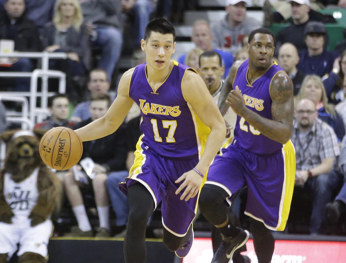 Lakers point guard Jeremy Lin leads the break against the Jazz.