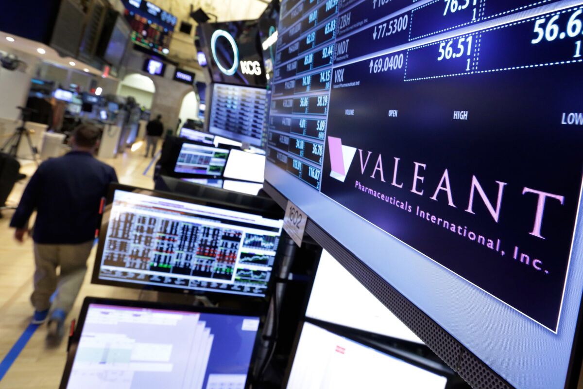 A trading post on the floor of the New York Stock Exchange displays the Valeant Pharmaceuticals logo on March 15.