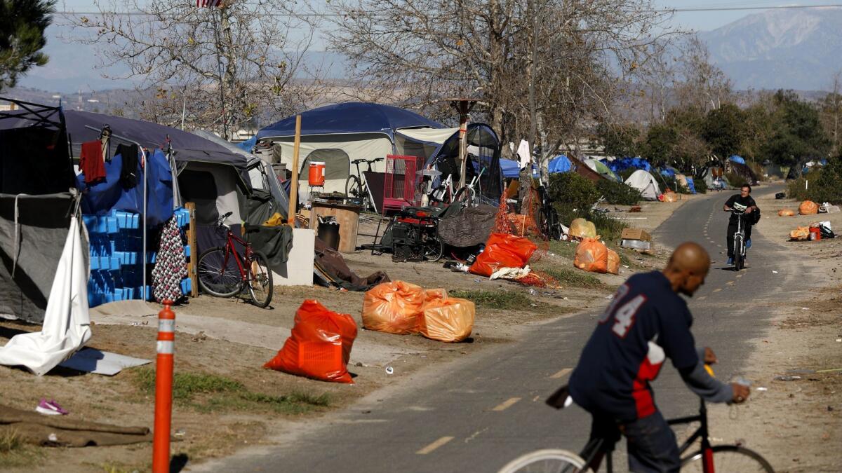 Orange County officials plan to clear the county’s largest homeless encampment, a tent city along the Santa Ana River in Anaheim and Orange where several hundred people live. A temporary restraining order bars sheriff’s deputies from arresting homeless people who refuse to leave.