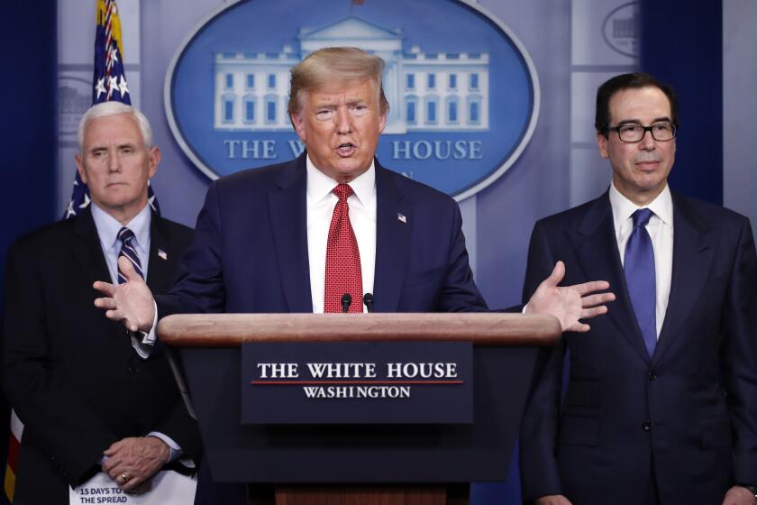 President Donald Trump speaks about the coronavirus in the James Brady Briefing Room, Wednesday, March 25, 2020, in Washington, as Vice President Mike Pence and Treasury Secretary Steven Mnuchin listen. (AP Photo/Alex Brandon)