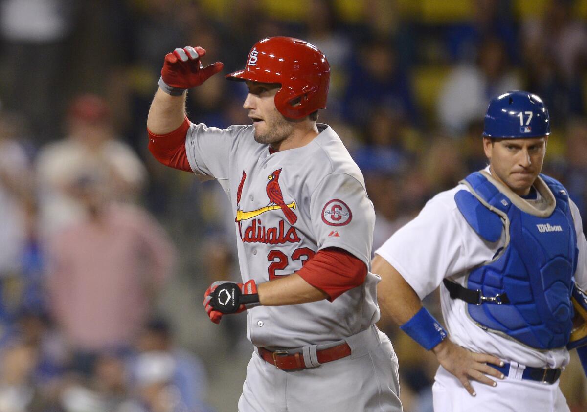 Cardinals third baseman David Freese celebrates after hitting a two-run home run against the Dodgers on Friday night.