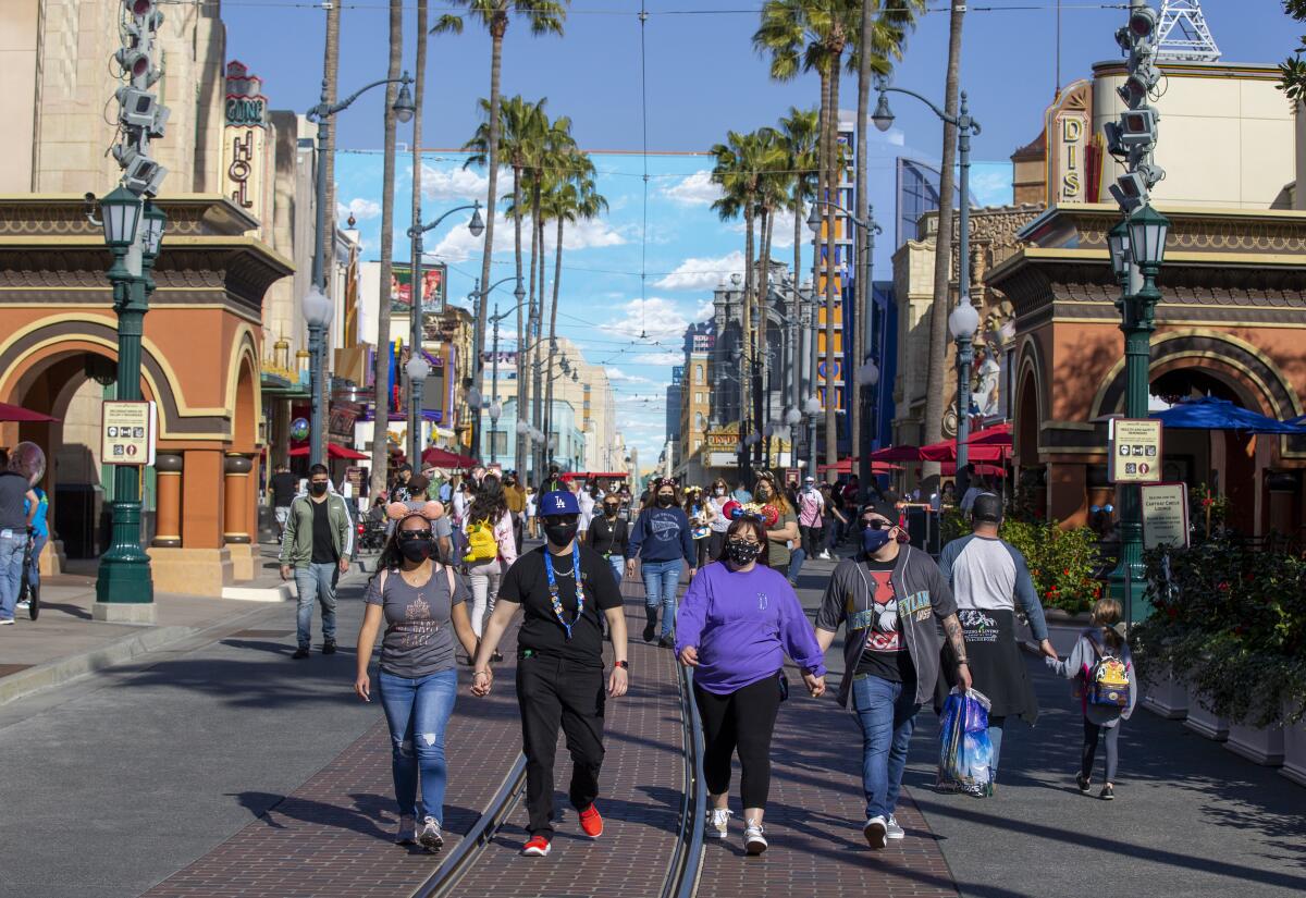  Disney fans stroll through Hollywood Land the debut of A Touch of Disney at California Adventure. 