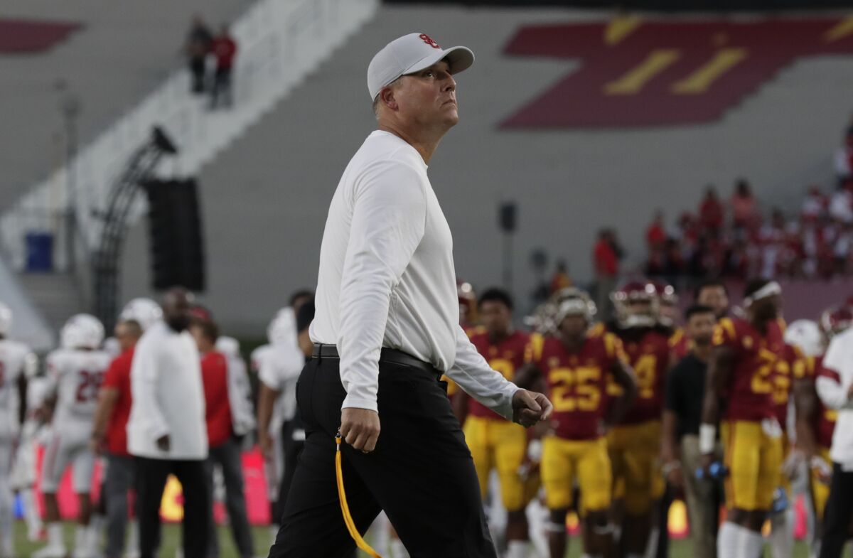 USC football coach Clay Helton is shown during warmups for the Fresno State game at the Coliseum on Aug. 31.