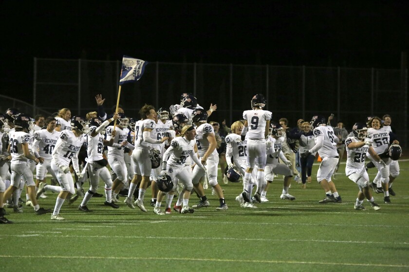 The Newport Harbor football team celebrates after winning the CIF Division 6 final against Temecula Valley on Saturday.