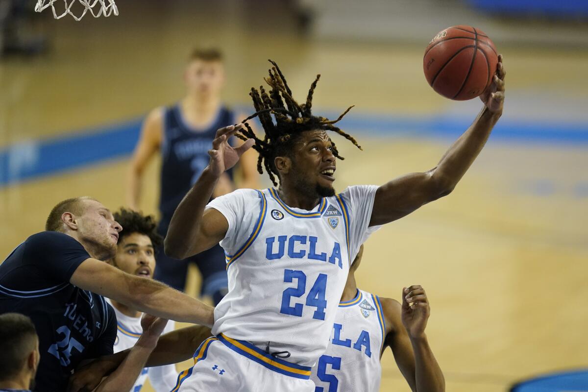 UCLA forward Jalen Hill grabs a rebound.