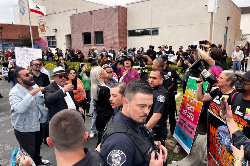 Protesters face off at Glendale Unified School District headquarters.