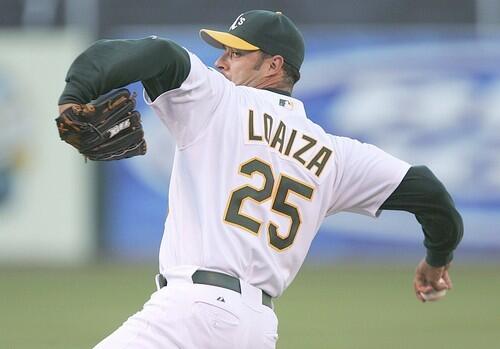 Esteban Loaiza of the Oakland Athletics pitches against the Los Angeles Angels of Anaheim at McAfee Coliseum.