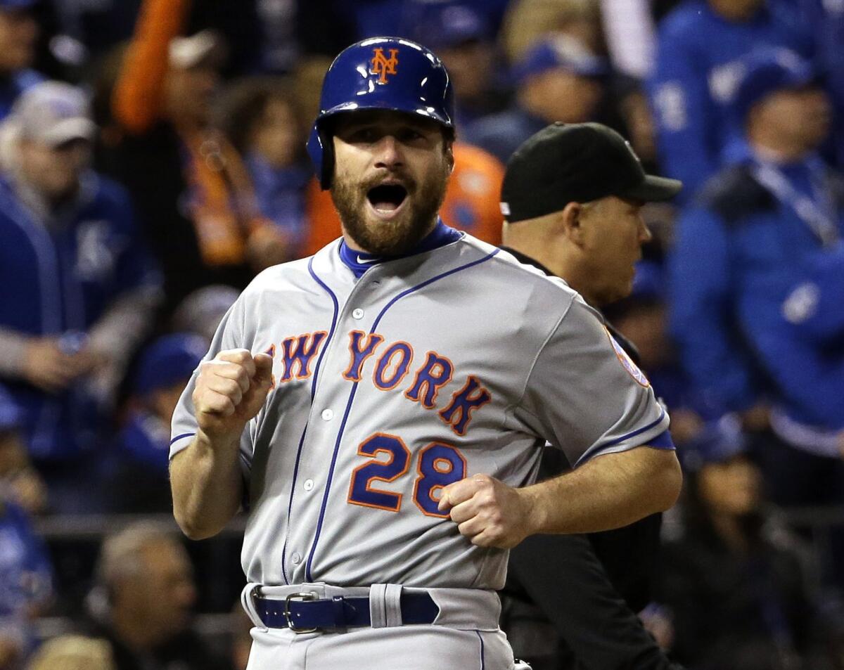 Second baseman Daniel Murphy reacts after he scores on a hit by Mets first baseman Lucas Duda during Game 2 of the World Series.