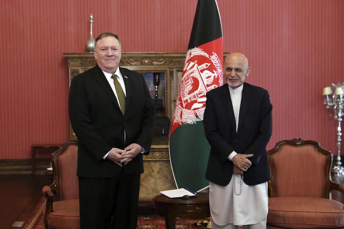Secretary of State Michael R. Pompeo meets with Afghan President Ashraf Ghani at the presidential palace in Kabul on March 23, 2020. Pompeo sought to rescue a U.S.-Taliban agreement deal but failed to make apparent progress.