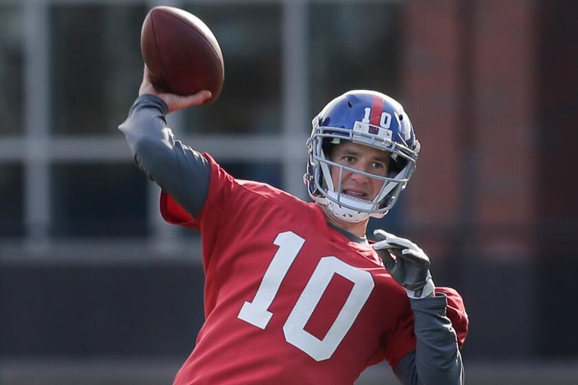 New York Giants quarterback Eli Manning throws during an NFL football practice in East Rutherford, N.J., Wednesday, Dec. 6, 2017. (AP Photo/Seth Wenig)