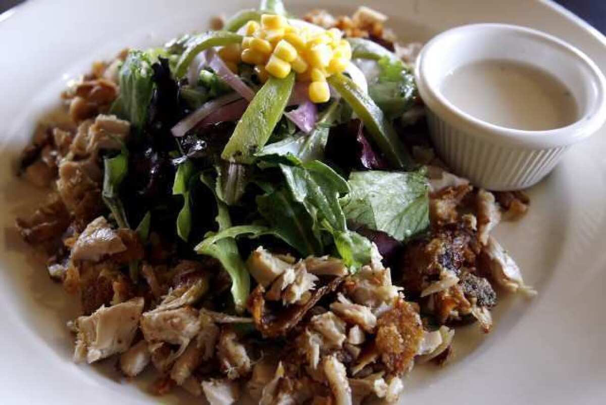 Larkin's Fried Chicken Salad includes dark meat chicken, mixed greens with balsamic vinegar and a side of buttermilk dressing, at the Eagle Rock restaurant.