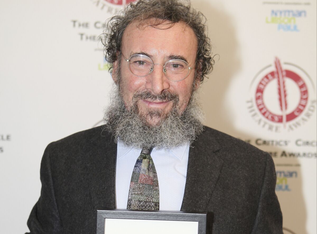 FILE - Actor Antony Sher poses for photographers after winning the best Shakespearean performance award at the Critics' Circle Theatre Awards in central London Jan. 27, 2015. Sher, one of the most acclaimed Shakespearean actors of his generation, has died aged 72, the Royal Shakespeare Company said Friday, Dec. 3, 2021. Sher had been diagnosed with terminal cancer earlier this year. (Grant Pollard/Invision/AP, file)