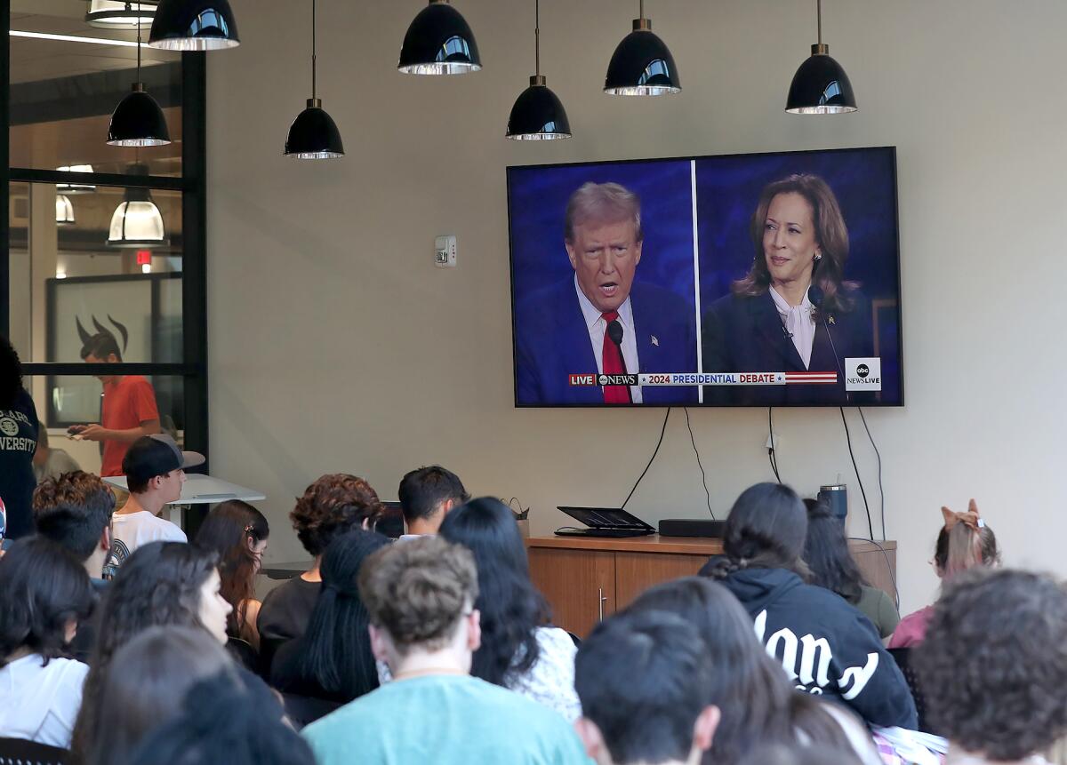 Vanguard students listen during a presidential debate watch party on campus on Tuesday night.