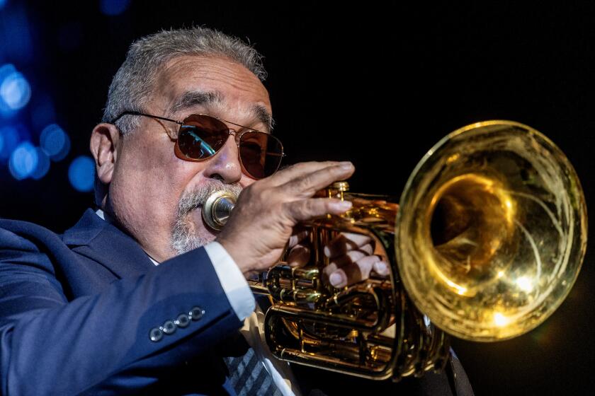 Musician Willie Colon performs on stage at Los Angeles Salsa Festival at Crypto.com Arena on Saturday July 29, 2023. (Photo by Ringo Chiu / For The Times)