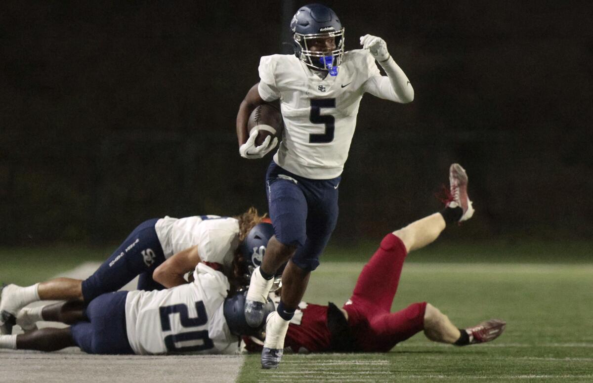 Sierra Canyon wide receiver Cameron Mitchell runs down the sideline for a first down in the second quarter.