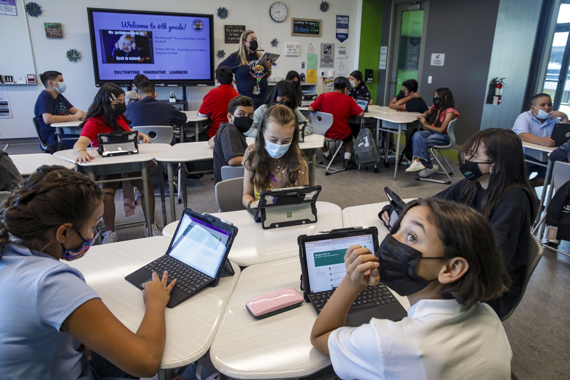 A sixth-grade class uses Microsoft Surface Pro laptops issued to them by Anaheim Elementary District.