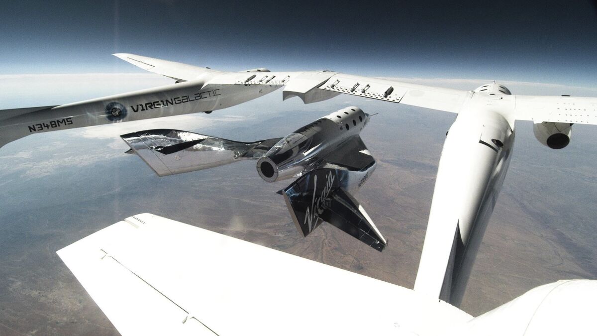 This photo provided by Virgin Galactic shows SpaceShipTwo Unity being released from the carrier mothership, VMS Eve for second successful glide flight in New Mexico on Thursday, June 25, 2020. Virgin Galactic is celebrating the second successful glide flight of its spaceship over Spaceport America in southern New Mexico. (Virgin Galactic via AP)