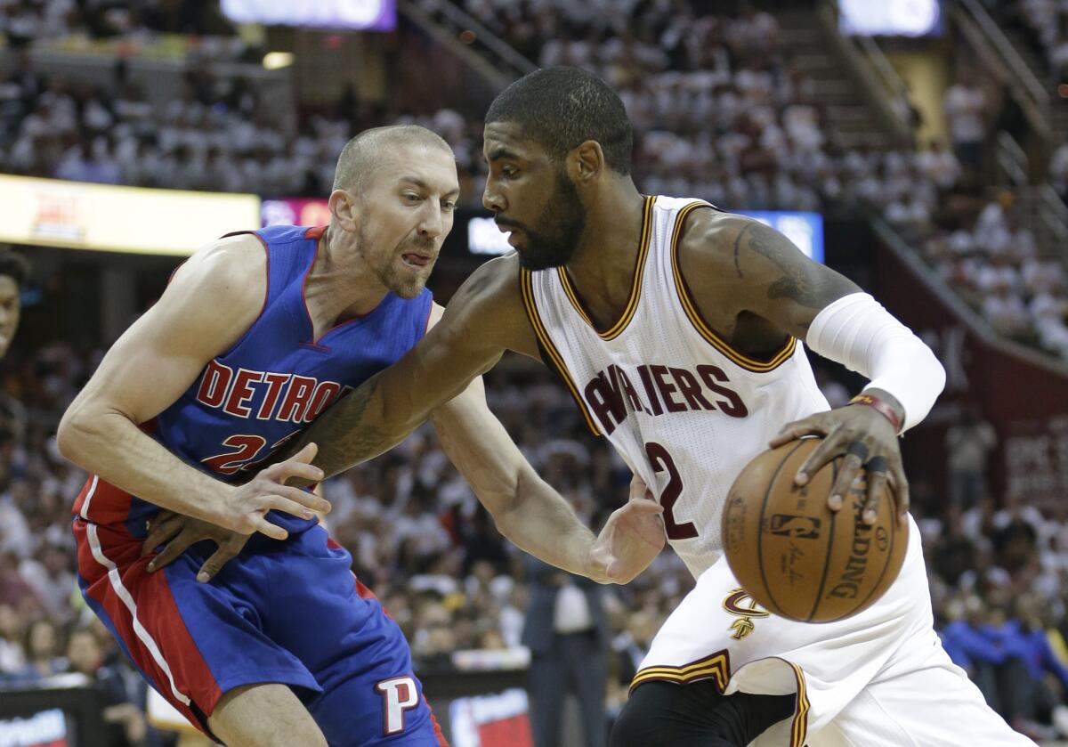 Cavaliers guard Kyrie Irving (2) drives past Pistons guard Steve Blake (22) in the first half of Game 1 of a first-round playoff series.
