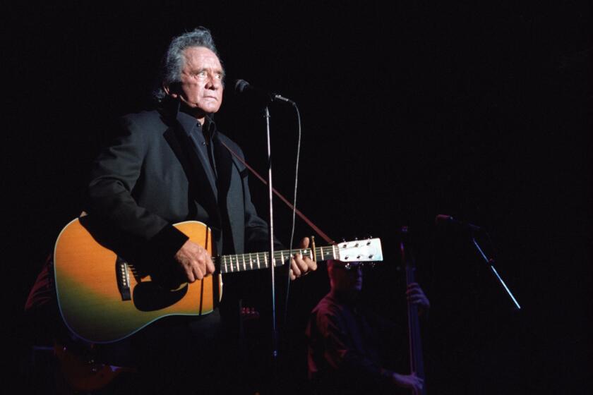 LOS ANGELES, CA - JUNE 14: Johnny Cash performs at the Greek Theatre in Los Angeles, California on June 14, 1997. (Photo by Jim Steinfeldt/Michael Ochs Archives/Getty Images)