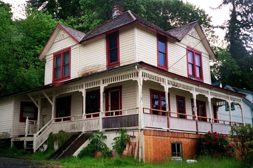 FILE - The house featured in the Steven Spielberg film "The Goonies" is seen in Astoria, Ore., on May 24, 2001. The Victorian home, built in 1896 with sweeping views of the Columbia River as it flows into the Pacific Ocean, is now for sale has been listed with an asking price of $1.7 million. Since the film was released in 1985, fans have flocked to the home, and the owner has long complained of constant crowds and trespassing. (AP Photo/Stepanie Firth, File)