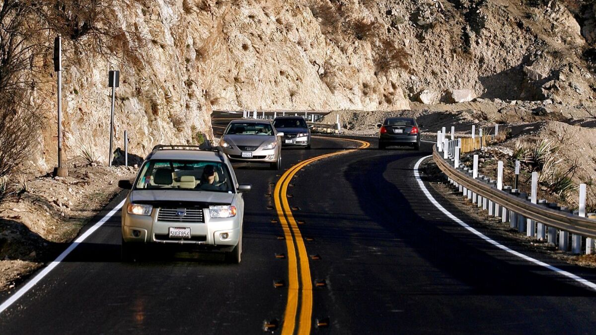 Drivers make their ways north and south on the Angeles Crest Highway through the Angeles National Forest just above La Cañada Flintridge in this photo from late 2009.