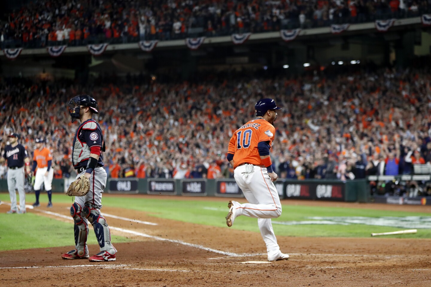 HOUSTON, TX - OCTOBER 30: Yuli Gurriel #10 of the Houston Astros reacts to scoring a run on a Carlos Correa #1 RBI double in the fifth inning during Game 7 of the 2019 World Series between the Washington Nationals and the Houston Astros at Minute Maid Park on Wednesday, October 30, 2019 in Houston, Texas. (Photo by Rob Tringali/MLB Photos via Getty Images)