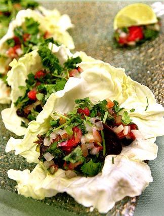 "Tacos" of seasoned mushrooms stuffed in a cabbage leaf with pico de gallo, avocado and cilantro are spicy and balanced.