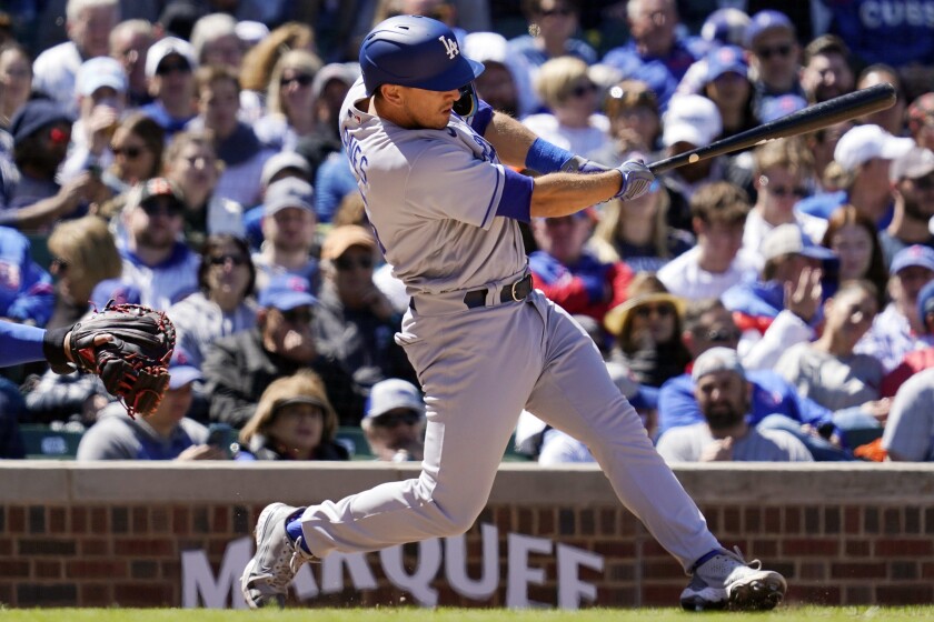 Dodgers catcher Austin Barnes hits a two-run single against the Chicago Cubs in Saturday's eighth inning in Game 1.